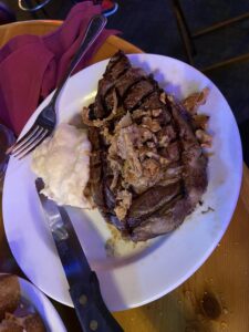 Prime Rib cooked medium rare with mashed potatoes